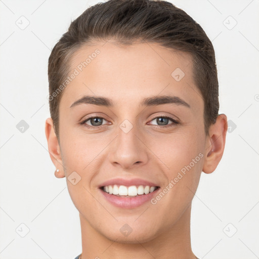 Joyful white young-adult female with short  brown hair and brown eyes