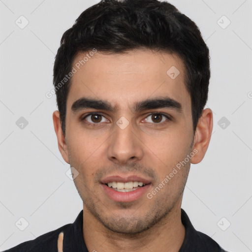 Joyful white young-adult male with short  black hair and brown eyes