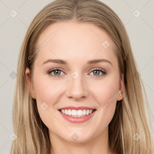 Joyful white young-adult female with long  brown hair and grey eyes