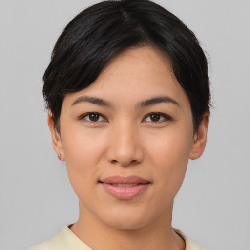 Joyful asian young-adult female with short  black hair and brown eyes