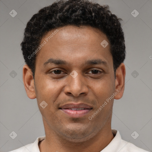 Joyful latino young-adult male with short  brown hair and brown eyes