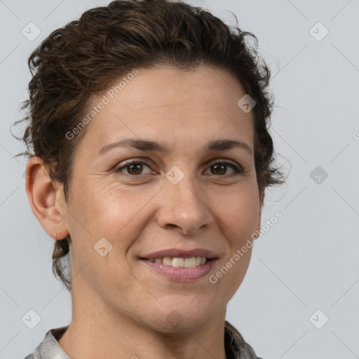 Joyful white adult female with short  brown hair and brown eyes