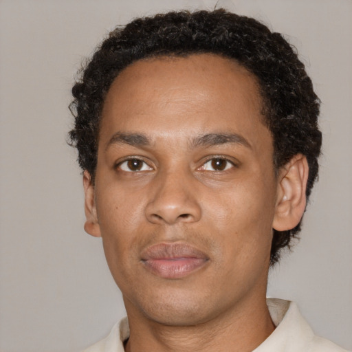 Neutral black young-adult male with short  black hair and brown eyes