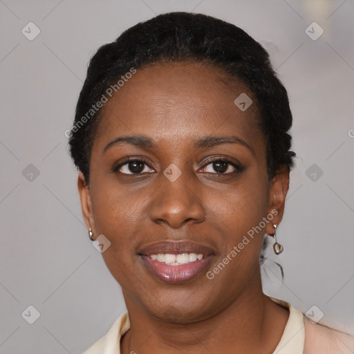 Joyful black young-adult female with short  black hair and brown eyes