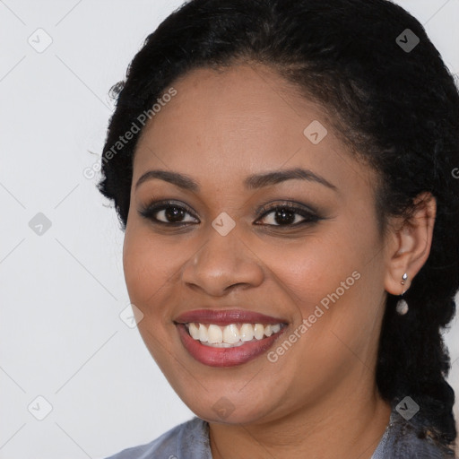 Joyful black young-adult female with long  black hair and brown eyes