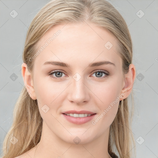 Joyful white young-adult female with medium  brown hair and blue eyes