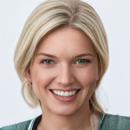 Joyful white young-adult female with medium  brown hair and blue eyes