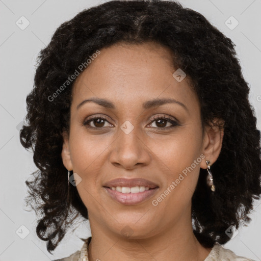 Joyful black young-adult female with medium  brown hair and brown eyes