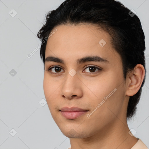 Joyful latino young-adult male with short  black hair and brown eyes