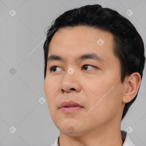 Neutral asian young-adult male with short  black hair and brown eyes