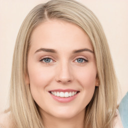 Joyful white young-adult female with long  brown hair and green eyes