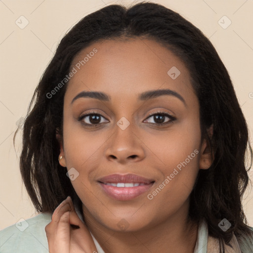 Joyful latino young-adult female with long  brown hair and brown eyes