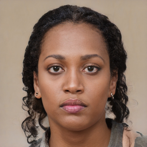 Neutral black young-adult female with medium  black hair and brown eyes