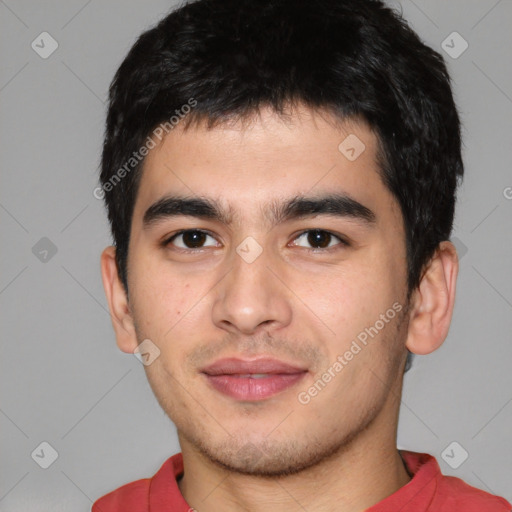 Joyful white young-adult male with short  black hair and brown eyes