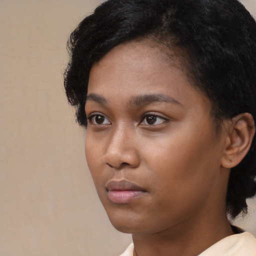 Neutral black young-adult female with short  black hair and brown eyes
