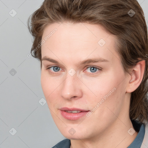 Joyful white young-adult female with medium  brown hair and blue eyes