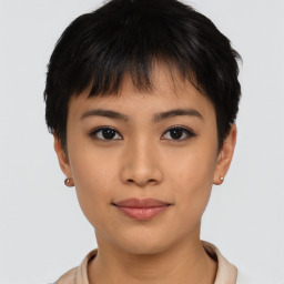 Joyful asian young-adult female with short  brown hair and brown eyes