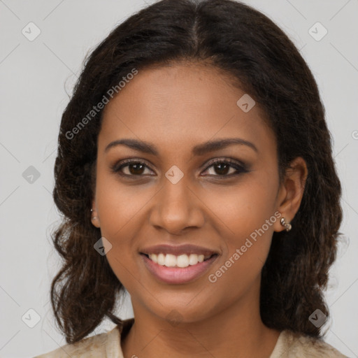 Joyful black young-adult female with medium  brown hair and brown eyes