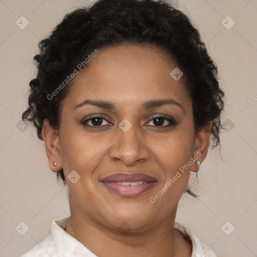 Joyful latino adult female with short  brown hair and brown eyes