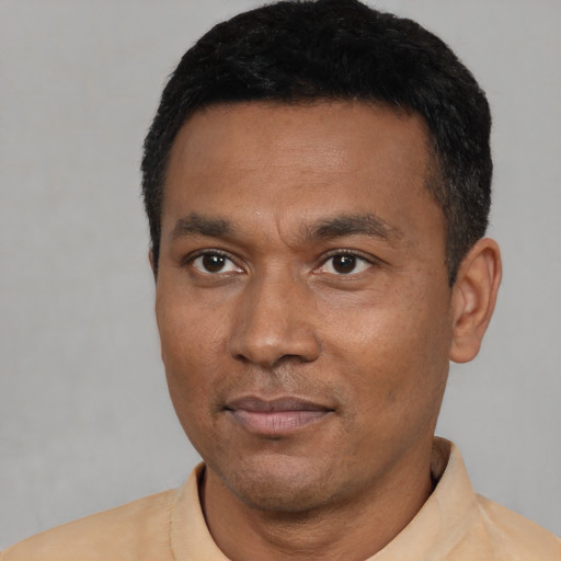 Neutral latino adult male with short  black hair and brown eyes