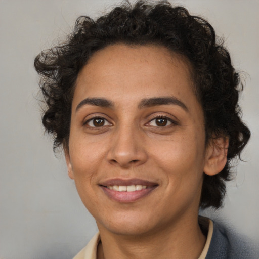 Joyful white adult female with short  brown hair and brown eyes