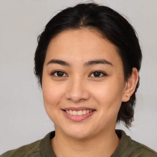 Joyful white young-adult female with medium  brown hair and brown eyes