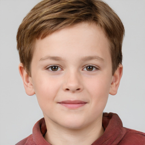 Joyful white child male with short  brown hair and grey eyes