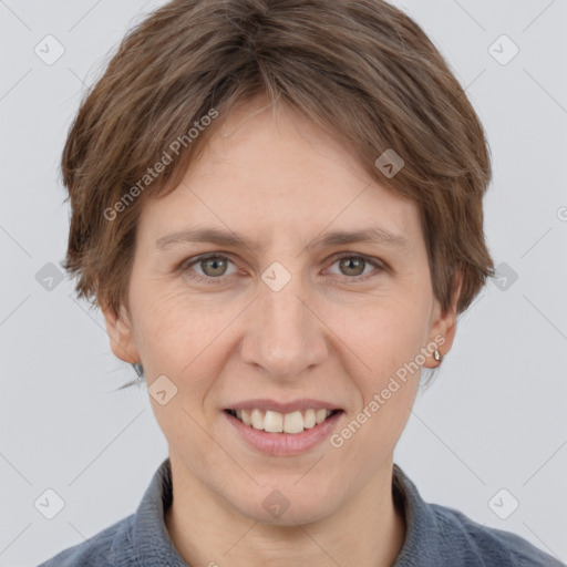 Joyful white adult female with short  brown hair and grey eyes