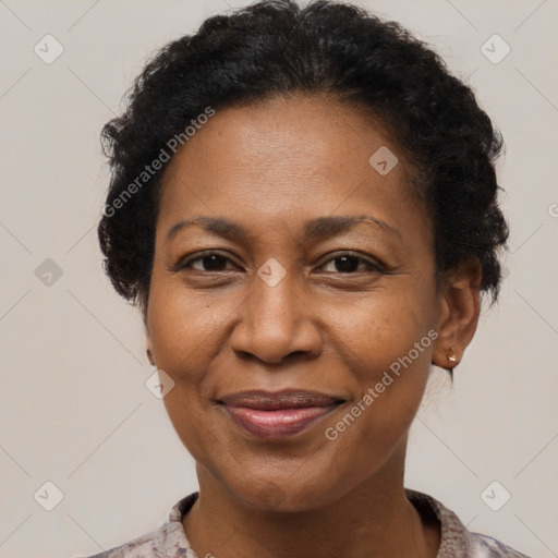 Joyful black adult female with short  brown hair and brown eyes