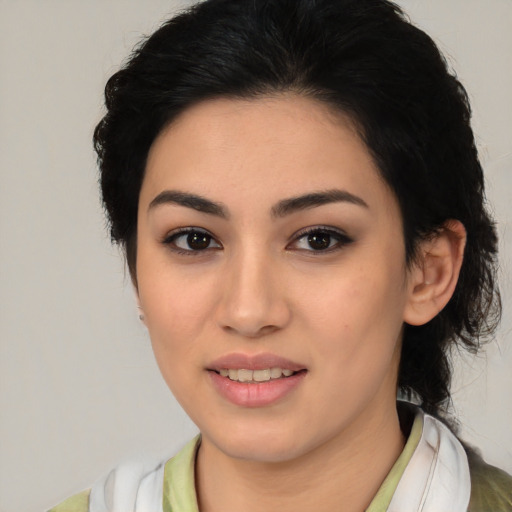 Joyful latino young-adult female with medium  black hair and brown eyes