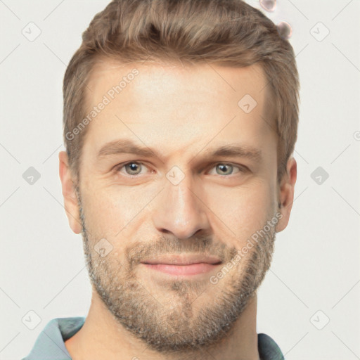 Joyful white adult male with short  brown hair and grey eyes