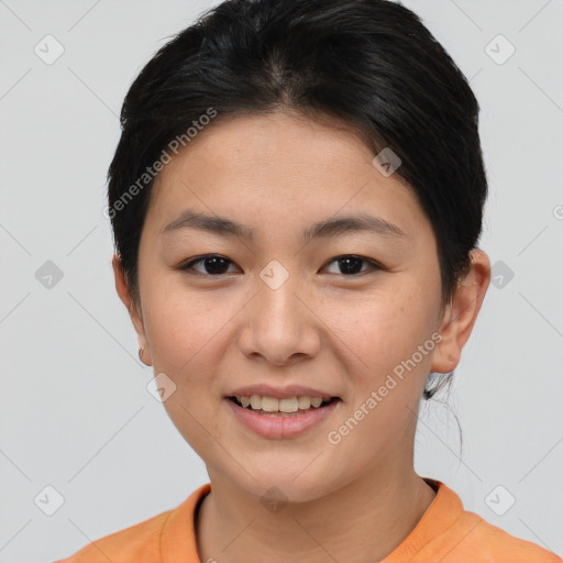 Joyful asian young-adult female with short  brown hair and brown eyes