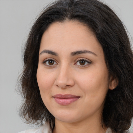 Joyful white young-adult female with medium  brown hair and brown eyes