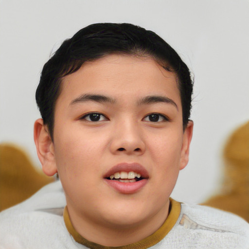 Joyful asian child male with short  brown hair and brown eyes