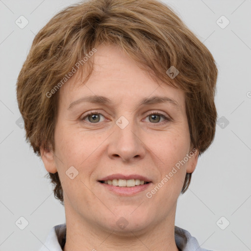 Joyful white adult female with short  brown hair and grey eyes