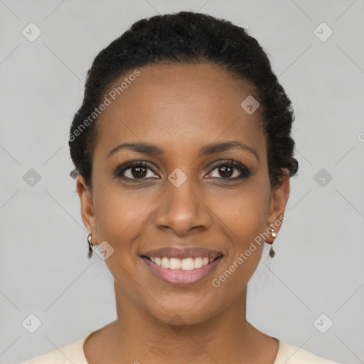 Joyful black young-adult female with short  black hair and brown eyes