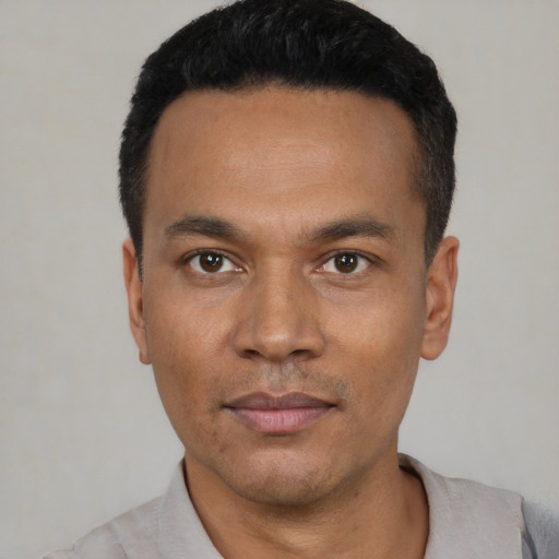 Neutral latino young-adult male with short  black hair and brown eyes