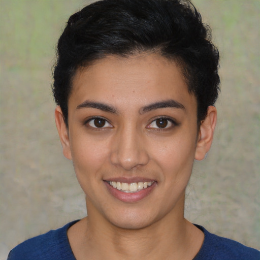 Joyful latino young-adult female with short  black hair and brown eyes