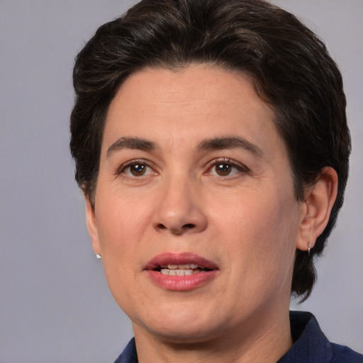 Joyful white adult female with medium  brown hair and brown eyes