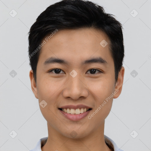 Joyful asian young-adult male with short  black hair and brown eyes