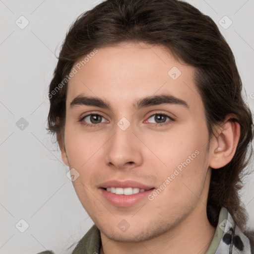 Joyful white young-adult male with medium  brown hair and brown eyes