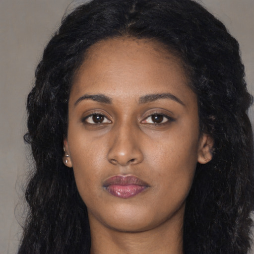 Neutral black young-adult female with long  black hair and brown eyes