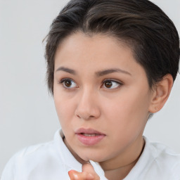 Neutral white young-adult female with short  brown hair and brown eyes