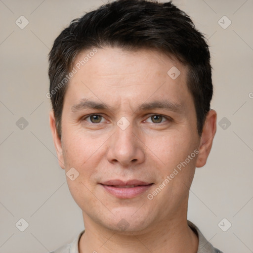 Joyful white young-adult male with short  brown hair and brown eyes