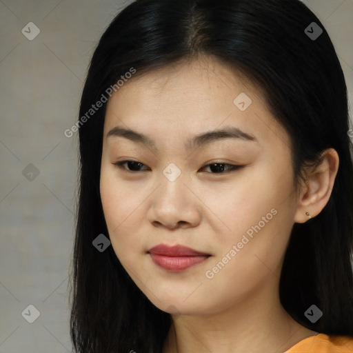 Joyful asian young-adult female with long  brown hair and brown eyes