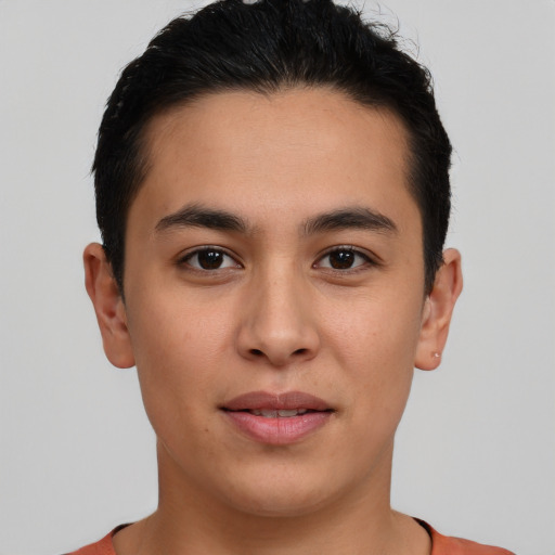 Joyful latino young-adult male with short  brown hair and brown eyes