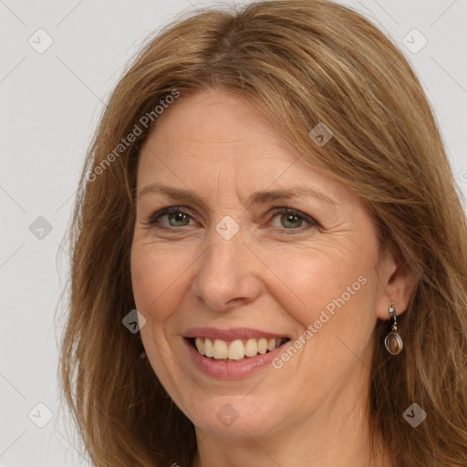 Joyful white adult female with long  brown hair and brown eyes