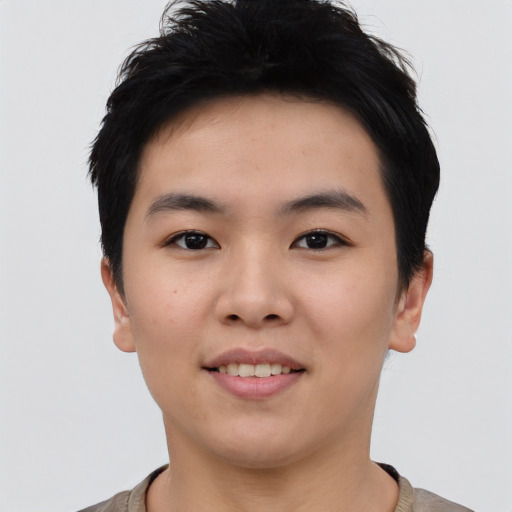 Joyful asian young-adult female with short  black hair and brown eyes
