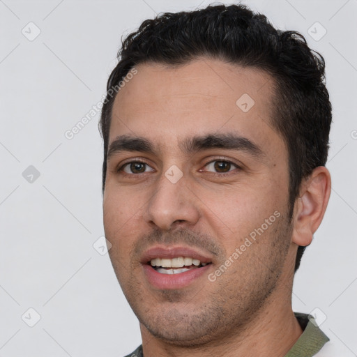 Joyful white young-adult male with short  black hair and brown eyes