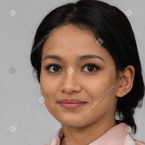 Joyful asian young-adult female with medium  black hair and brown eyes